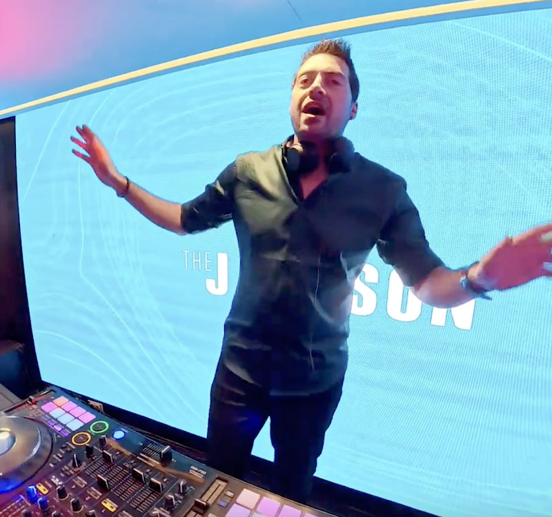 Disc Jockey entertaining guests on a cruise